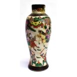 A BALUSTER SHAPED VASE AND COVER decorated with scenes of warring soldiers, 33cm high