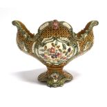 A MAJOLICA VASE WITH MOULDED FLORAL AND SWAG DECORATION 30cm wide 23cm high