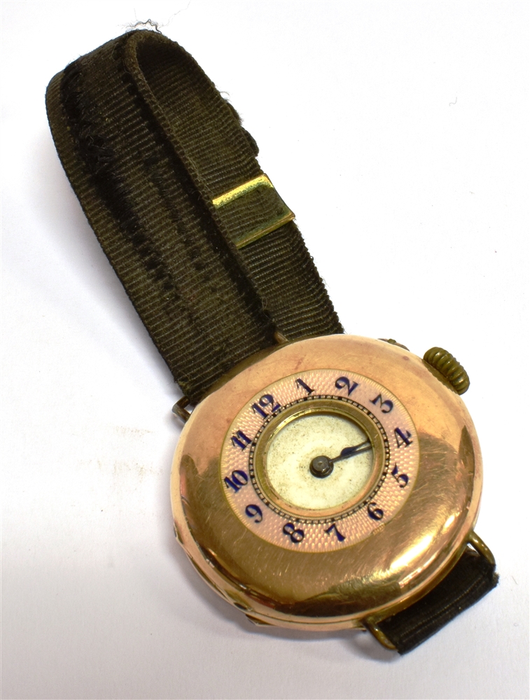 A 14CT GOLD EARLY WRIST WATCH (conversion from a pocket watch) half hunter design, pink enamel outer