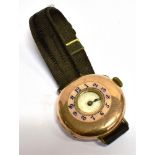 A 14CT GOLD EARLY WRIST WATCH (conversion from a pocket watch) half hunter design, pink enamel outer