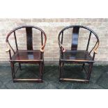 A PAIR OF CHINESE HARDWOOD HORSESHOE ARMCHAIRS