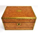 A VICTORIAN BRASS MOUNTED BURR WOOD JEWELLERY BOX the lid opening to velvet lined fitted interior,
