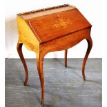 A CONTINENTAL MAQUETRY DECORATED BUREAU DE DAME with gilt metal gallery and fitted interior, on
