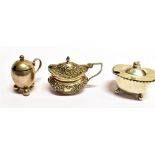 THREE ASSORTED SILVER MUSTARD POTS comprising an egg shape plain form on three ball feet, hallmarked