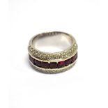 A RUBY AND DIAMOND THREE ROW HALF HOOP 18CT WHITE GOLD RING The central channel set row comprising