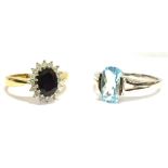 TWO 9CT GOLD DRESS RINGS comprising a white gold topaz set single stone, the oval topaz approx. 10 x