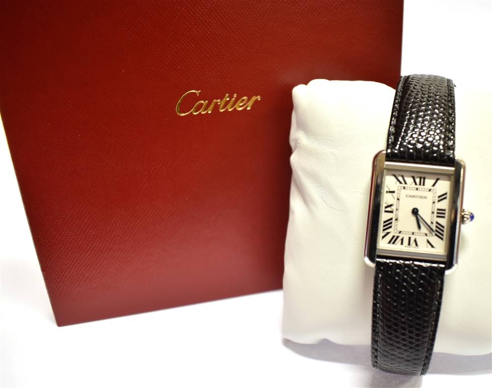 A LADIES CARTIER TANK STAINLESS STEEL WATCH On a leather strap, ivory coloured oblong dial, black