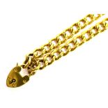 AN EARLY 20TH CENTURY 9CT GOLD CURB LINK BRACELET With padlock fastener, the twisted curb links of