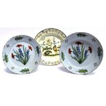TWO 18TH CENTURY ENGLISH DELFT PLATES with painted floral decoration, 23cm diameter; and a further