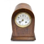 AN EDWARDIAN INLAID MAHOGANY MANTLE CLOCK with white enamel face and French eight-day movement