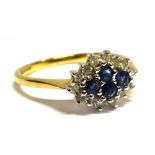 A SAPPHIRE AND DIAMOND LOZENGE SHAPED CLUSTER RING four central round mixed cut blue sapphires