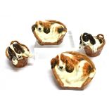 FOUR BESWICK FIGURES OF SPANIELS in their baskets, two no HN2585 and two HN2586, 9cm wide