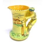 CRICKET - A 1930S BURLEIGH WARE JUG hand painted on a yellow and green ground, the handle formed