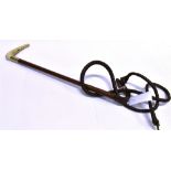 A LADY'S HUNTING WHIP, by Swaine with antler grip, silver collar and plaited leather shaft and