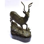 A CAST FIGURE OF A STAG on a shaped black marble base, height 26cm