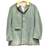 A GENT'S GREEN HUNT COAT with mustard coloured collar and check lining, by Bernard Weatherill, and