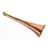 AN UNUSUAL COPPER AND BRASS OVAL HUNTING HORN 26cm long