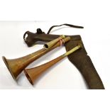 TWO HUNTING HORNS both AF, and a leather horn case for saddle mounting, 26cm (3)