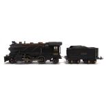 [O GAUGE]. A LIONEL LINES 2-4-2 TENDER LOCOMOTIVE, 262 black livery, with a 3-rail electric motor,
