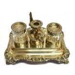 A GEORGIAN SMALL SILVER INKSTAND With two silver topped glass ink bottles with central taper