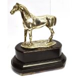 A SILVER FIGURE OF A STANDING HORSE ON A WOODEN BASE the realistically modelled horse by Lambert &