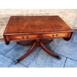 A REPRODUCTION SOFA TABLE with two frieze drawers, on quatrefoil supports, 72cm deep 108cm wide (