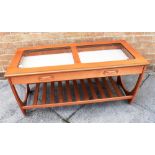 A MODERN G PLAN COFFEE TABLE with glass inset top, frieze drawer and magazine rack undertier,