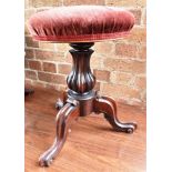 A VICTORIAN ROSEWOOD REVOLVING PIANO STOOL the circular upholstered seat 34cm diameter