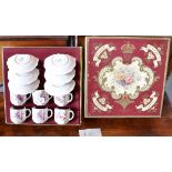 A BOXED SET OF SIX ROYAL CROWN DERBY CUPS AND SAUCERS with floral decoration