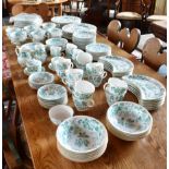 AN EXTENSIVE WEDGWOOD DINNER AND TEA SERVICE with green transfer printed foliate decoration within