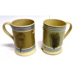 TWO VICTORIAN MOCHA WARE QUART TANKARDS each typically decorated and with sprigged crown and