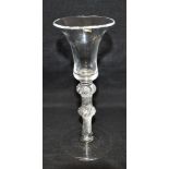 AN 18TH CENTURY WINE GLASS the trumpet shaped bowl with flared rim, on double knop air twist stem