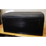 A 1920S LARGE BLACK REXINE-COVERED MOTOR CAR TRUNK with a sloping hinged lid, carrying handles,