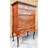 A MAHOGANY CHEST ON STAND the upper section with moulded frieze, two short and three long drawers,