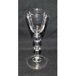 AN 18TH CENTURY WINE GLASS with bell shaped bowl, plain stem with rounded knop and collar, on