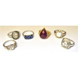 SIX SILVER STONE SET RINGS to include an opal cluster and a silver gilt single stone set with a