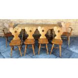 A CONTINENTAL OAK REFECTORY DINING TABLE the four plank top 75cm wide 183cm long, on shaped