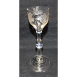 AN 18TH CENTURY WINE GLASS the bell shaped bowl engraved with vine leaves and a bird, plain