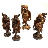 TWO PAIRS OF CHINESE CARVED HARDWOOD FIGURES inset with glass and bone eyes and teeth, all approx