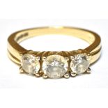 A 9CT GOLD DRESS RING Set with three white cubic zirconia, ring size O, gross weight approx. 3.5