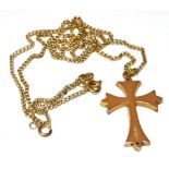 A 9CT GOLD CROSS AND CHAIN The scroll engraved gothic style cross 3cm long, to a 9ct gold curb