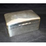 A SILVER CIGARETTE BOX Of plain rectangular form, 14cm x 9cm, unlined, cedar bottom and weighted