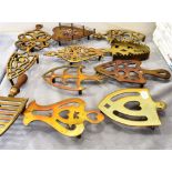 A GROUP OF ELEVEN VICTORIAN BRASS TRIVETS