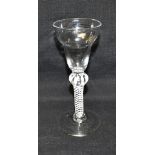 AN 18TH CENTURY WINE GLASS with pan topped bowl, on opaque air twist knopped stem, on conical