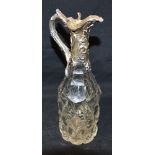 AN EARLY VICTORIAN SMALL SILVER TOPPED GLASS CLARET JUG The ornate silver top with embossed