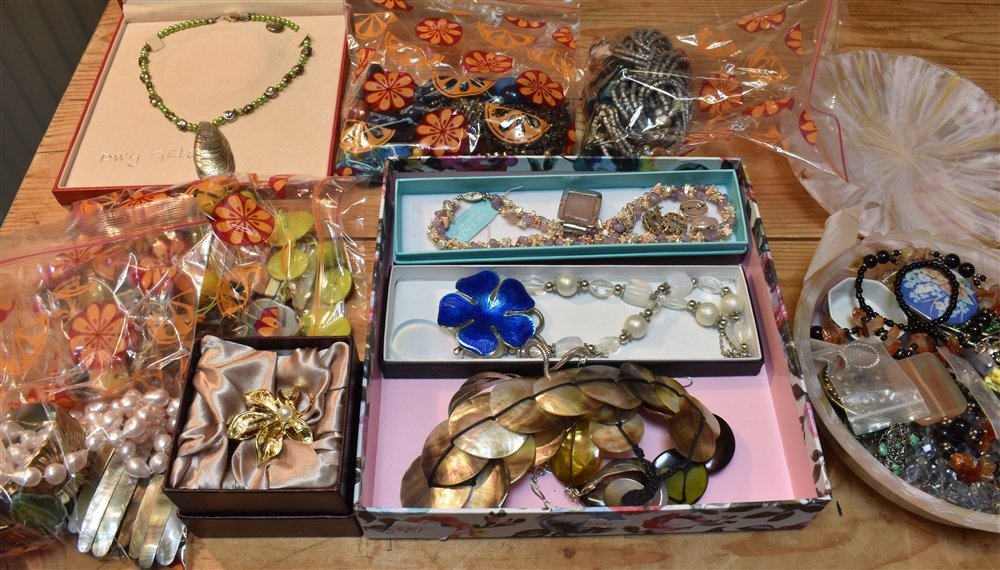 A LARGE QUANTITY OF ASSORTED COSTUME JEWELLERY to include vintage bead necklaces, also brooches,