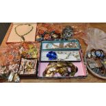 A LARGE QUANTITY OF ASSORTED COSTUME JEWELLERY to include vintage bead necklaces, also brooches,