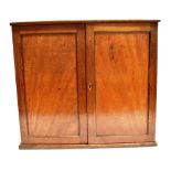 A GEORGE III MAHOGANY TABLE TOP COLLECTORS CABINET the doors opening to six drawers, brass ring