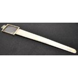 A SILVER PAGE TURNER/BOOKMARK With magnifying glass to top, the silver blade with clip and a