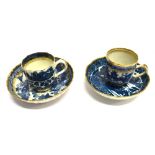 TWO LATE 18TH CENTURY CAUGHLEY TEA CUPS AND SAUCERS underglaze blue Chinoiserie decoration within